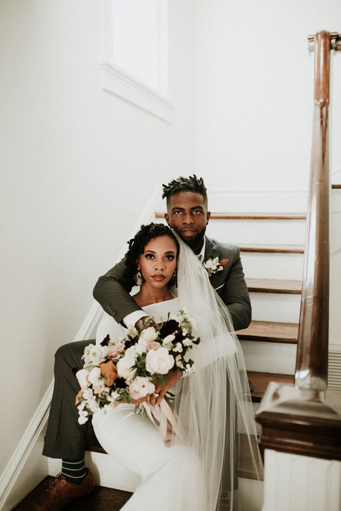 Couple sitting on stairs - Wedding Planning